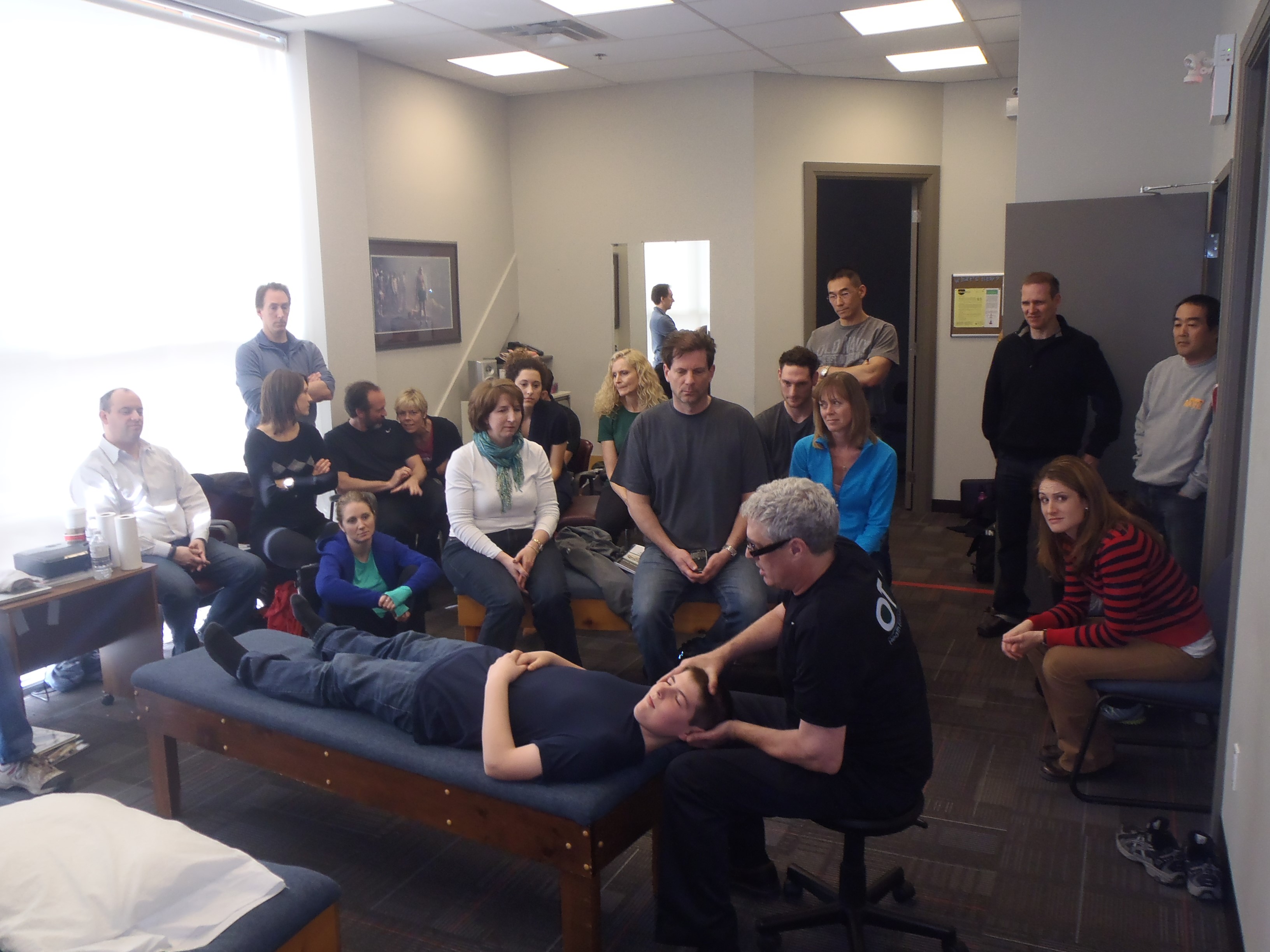 Dr. Murphy performs an adjustment before the crowd at the OTZ Seminar in Toronto.